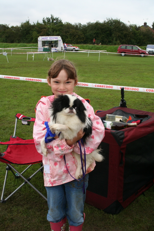 child, dog in arms